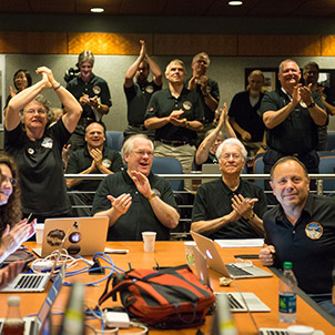 Part of the New Horizons team celebrating the spacecraft's flyby of Pluto.
